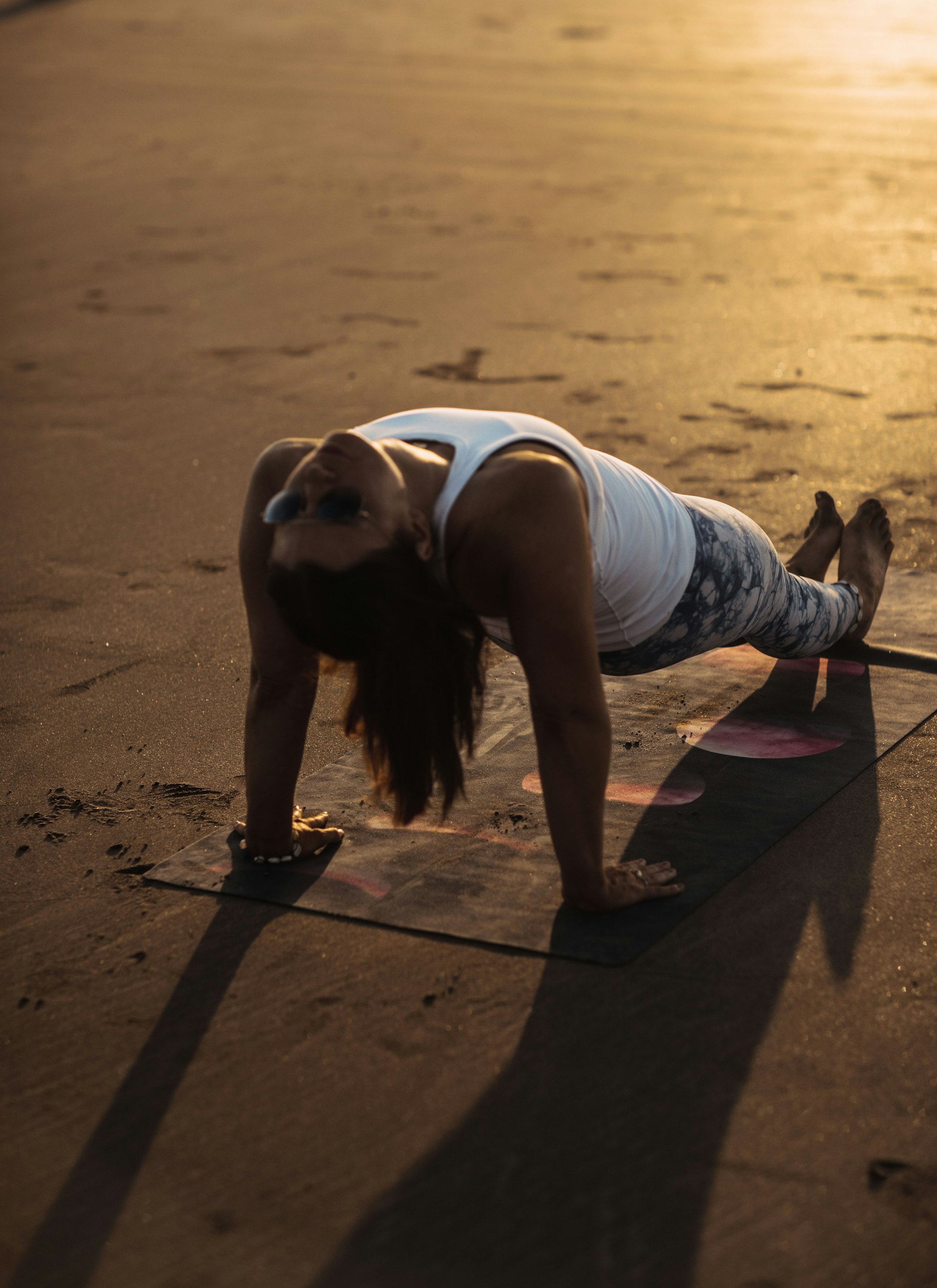 Plank hold training session outdoors in warm evening light